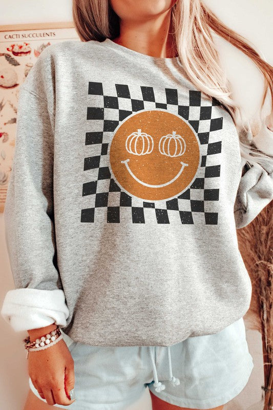 Sudadera con cara feliz y calabaza a cuadros