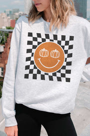 Sudadera con cara feliz y calabaza a cuadros